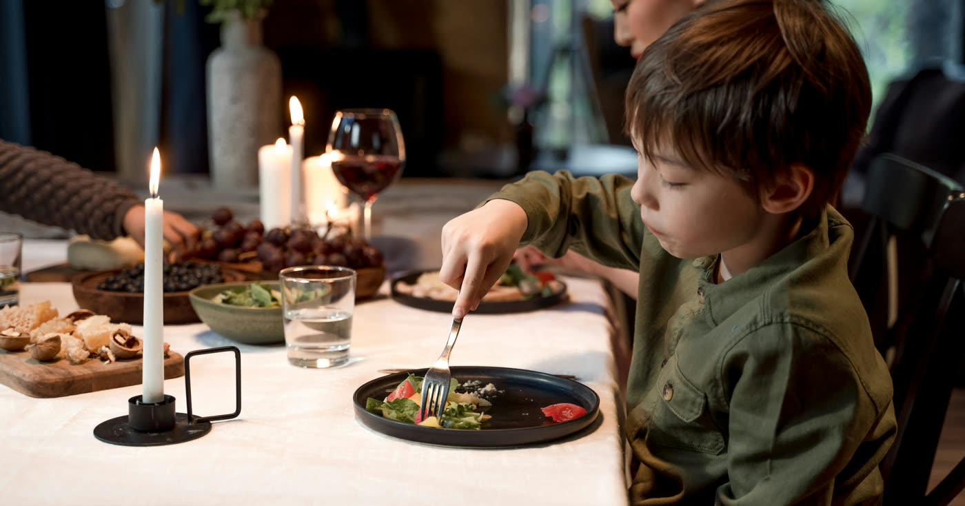 A family sharing a meal at a dining table
