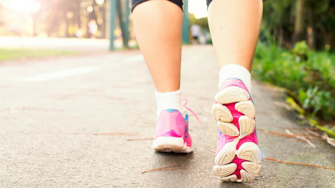 Close-up of walking shoes on a path, showing a simple reset during the first few days