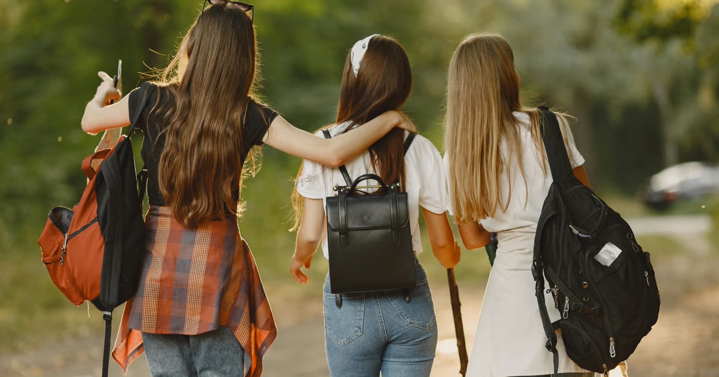 Friends walking together outdoors, a supportive smoke-free alternative